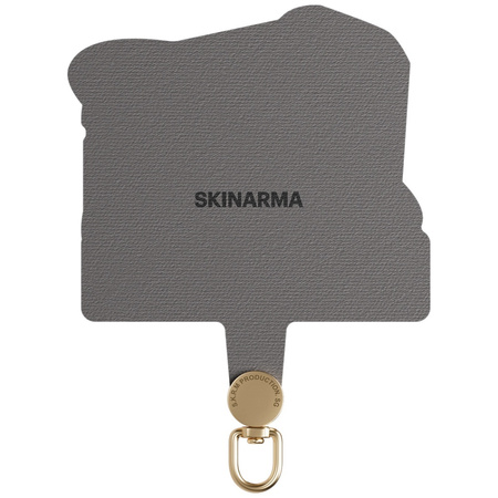 SKINARMA ADAPTER UNIWERSALNY DO SMYCZY Z PRZEJŚCIÓWKĄ DO TELEFONÓW